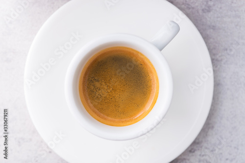 Espresso coffee in a white ceramic cup