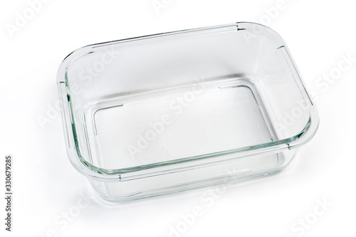Empty glass food storage container without lid on white background