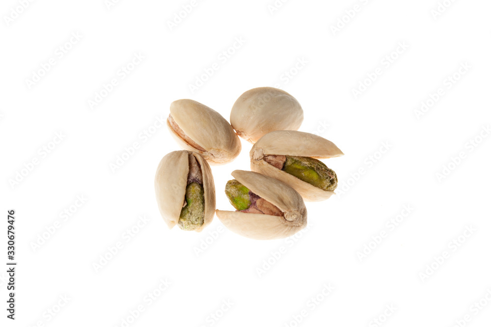 Salted pistachios nuts isolated on white background. Healthy snack. Salted pistachios nuts isolated on white background. Healthy snack.