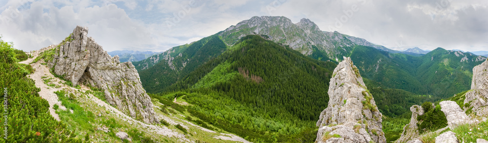 Rocky massif with rocks and pass on foreground, panoramic view