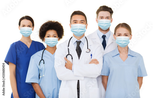 health, medicine and pandemic concept - doctors and nurses wearing protective medical masks on white background