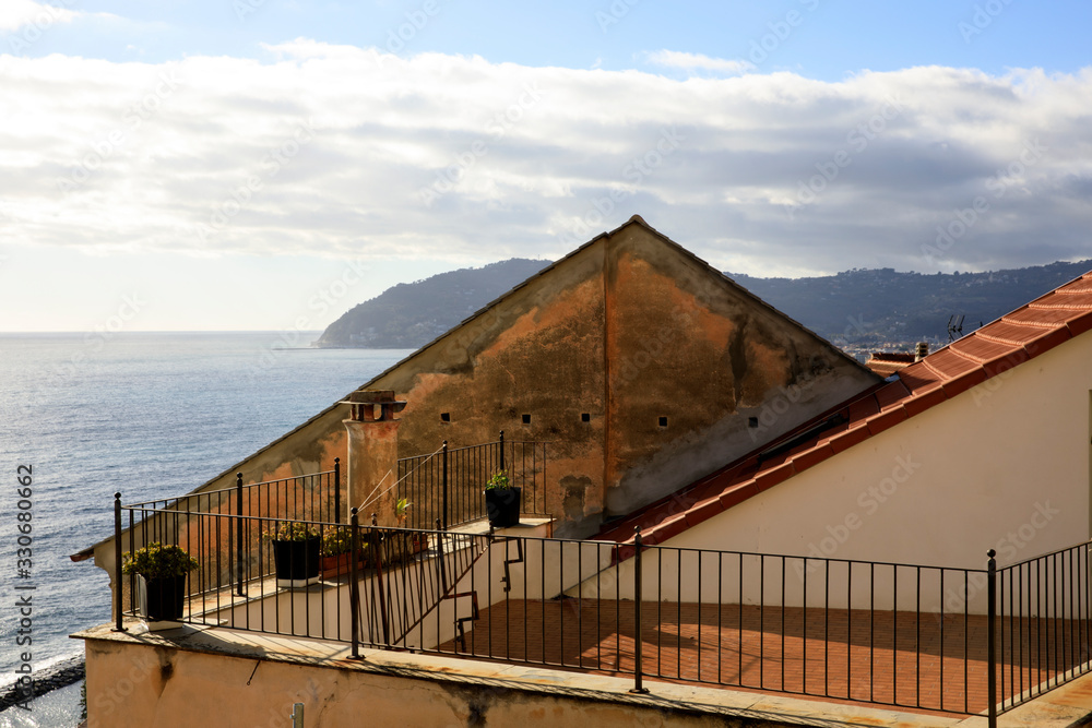 Cervo (IM), Italy - December 30, 2017: A tipycal house in Cervo village, Italian Riviera, Imperia, Liguria, Italy Cervo (IM), Italy - December 30, 2017: A tipycal house in Cervo village, Italian Riviera, Imperia, Liguria, Italy