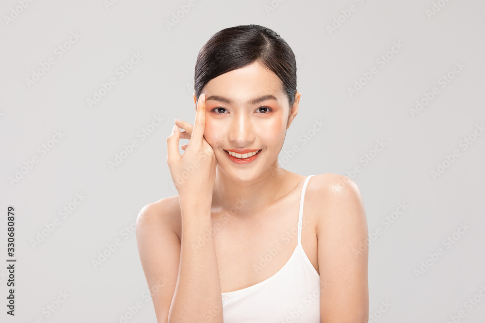 Beautiful Asian young woman touching soft cheek smile with clean fresh skin Happiness and cheerful with positive emotional,isolated on white background,Beauty Cosmetics and Facial treatment Concept Beautiful Asian young woman touching soft cheek smile with clean fresh skin Happiness and cheerful with positive emotional,isolated on white background,Beauty Cosmetics and Facial treatment Concept