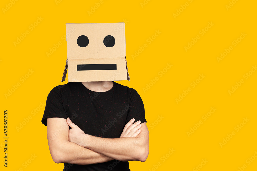 Portrait of an indifferent man with a box and cartoony emotions on his head. Unhappy people. - obrazy, fototapety, plakaty 