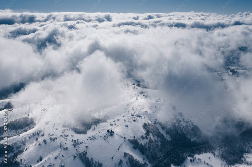Romania above the clouds. Severe snowy weather in winter time Romania above the clouds. Severe snowy weather in winter time