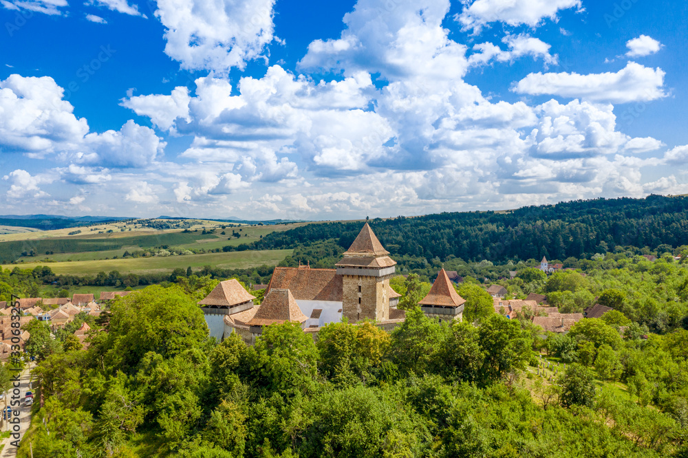 Summer landscape aerial view in Romania at Viscri fortified churh and traditional saxon village