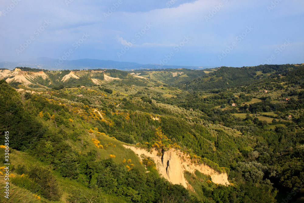Civita di Bagnoregio (VT), Italy - May 15, 2016: Soft eroded clay landscape around Civita di Bagnoregio, Tuscia, Lazio, Italy Civita di Bagnoregio (VT), Italy - May 15, 2016: Soft eroded clay landscape around Civita di Bagnoregio, Tuscia, Lazio, Italy