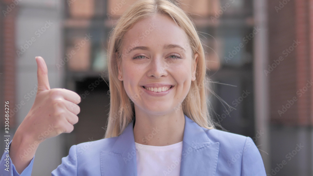 Thumbs Up by Young Businesswoman, Outdoor