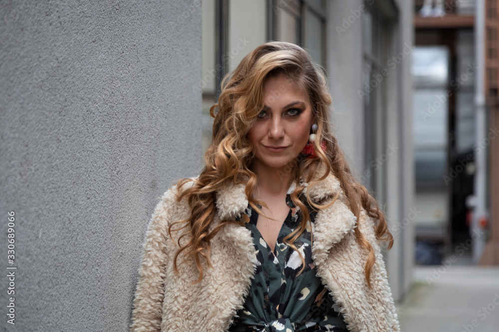 Beautiful woman with blonde long hair and blue eyes wanders the streets of Istanbul and poses for the camera Beautiful woman with blonde long hair and blue eyes wanders the streets of Istanbul and poses for the camera