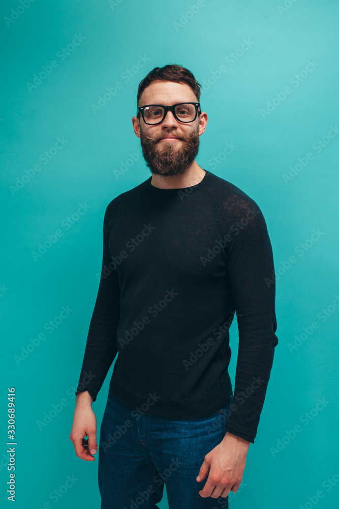 Handsome american hipster guy with beard wearing black long sleeve t-shirt or sweater with space for your brand name or label. Mockup for print