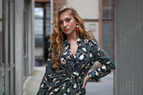 Beautiful woman with blonde long hair and blue eyes wanders the streets of Istanbul and poses for the camera