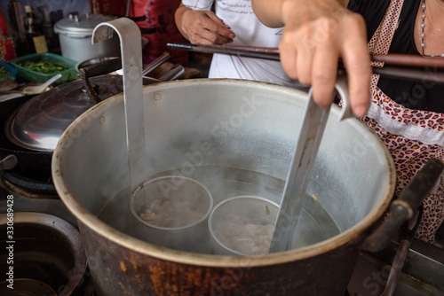The cooking process of Chinese traditional snacks, noodles served with soy sauce and pansit