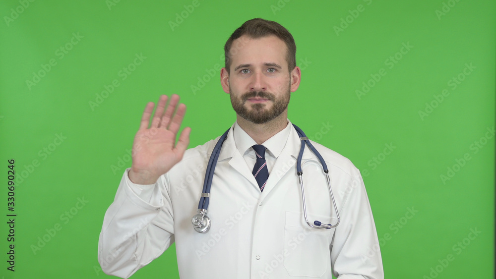 The Handsome Doctor Waving and Talking against Chroma Key The Handsome Doctor Waving and Talking against Chroma Key