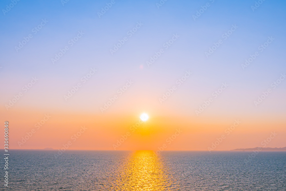 Beautiful sunset or sunrise around sea ocean bay with cloud on sky