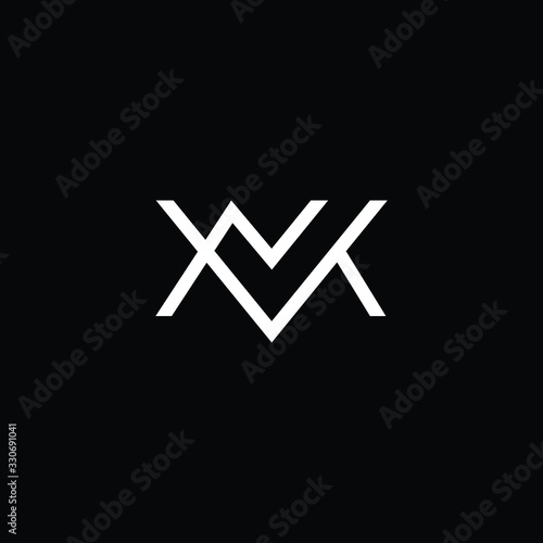 Minimal elegant monogram art logo. Outstanding professional trendy awesome artistic MN NM MV VM initial based Alphabet icon logo. Premium Business logo White color on black background