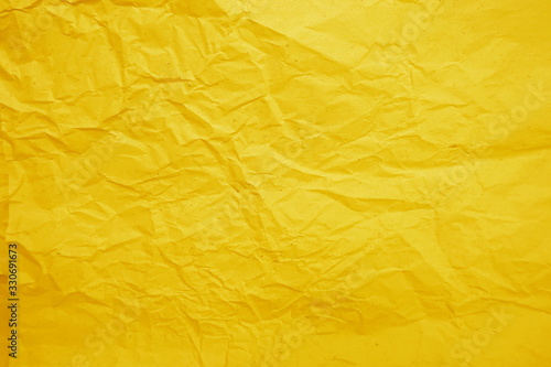 Yellow crumpled paper empty background
