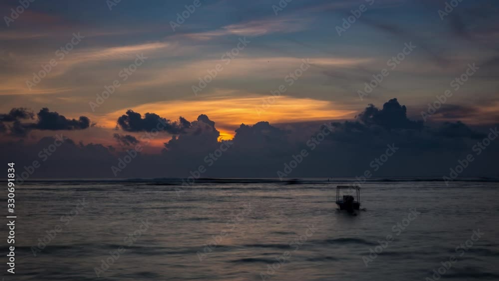 Timelapse of sunset with fishing boat from Lembongan Island, Bali, Indonesia Timelapse of sunset with fishing boat from Lembongan Island, Bali, Indonesia