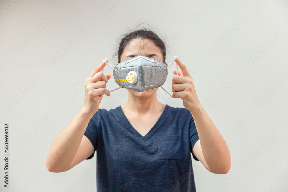 women wearing hygienic mask to prevent the virus PM2.5 and Coronavirus or COVID-19. People in masks The outbreak of Novel COVID-19 in Wuhan China. air pollution, Environmental awarenes women wearing hygienic mask to prevent the virus PM2.5 and Coronavirus or COVID-19. People in masks The outbreak of Novel COVID-19 in Wuhan China. air pollution, Environmental awarenes