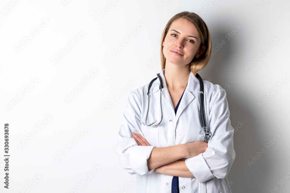 Medical concept of young female doctor in white coat with stethoscope Medical concept of young female doctor in white coat with stethoscope