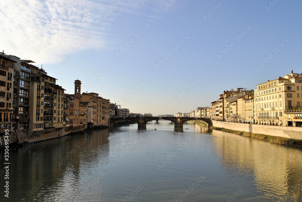 Old medieval Italian town Florence city buildings urban exterior historic panorama water bridge blue sky cityscape background