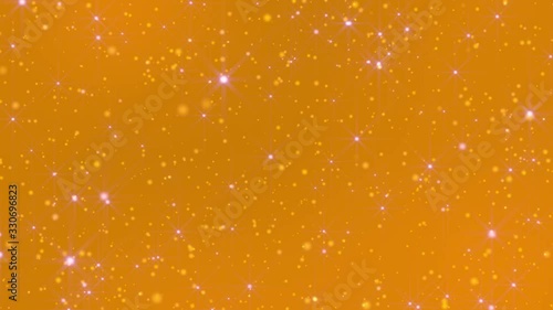 Loop golden dust background with beautiful bokeh. Shiny gold particles, blurred by out-of-focus (shallow depth of field), sparkle and rotate against a looped light abstract background. 4K, 60 fps.