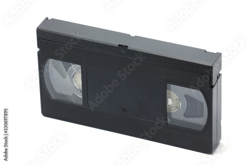 Old VHS black video cassette isolated on a white background
