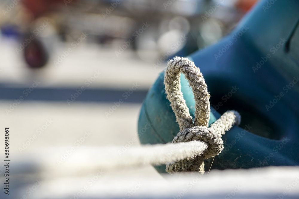 Rope tied up to a knot. close up
