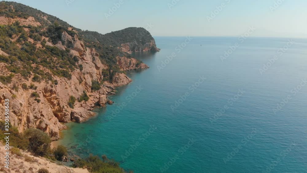 Aerial view of beautiful Greek island, coastline with turquoise sea Aerial view of beautiful Greek island, coastline with turquoise sea