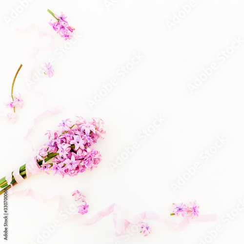 Floral bouquet made of hyacinth flowers and tapes on white background. Flat lay, top view. © artifirsov