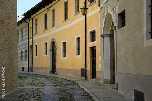 Fototapeta Naklejka Na Ścianę i Meble -  Orta San Giulio (NO), Italy - September 02, 2019: A typical small road in Orta San Giulio island, Orta, Novara, Piedmont, Italy