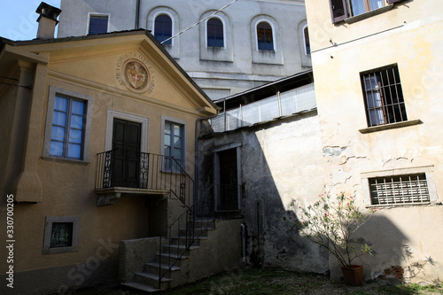 Fototapeta Naklejka Na Ścianę i Meble -  Orta San Giulio (NO), Italy - September 02, 2019: Houses detail in Orta San Giulio island, Orta, Novara, Piedmont, Italy