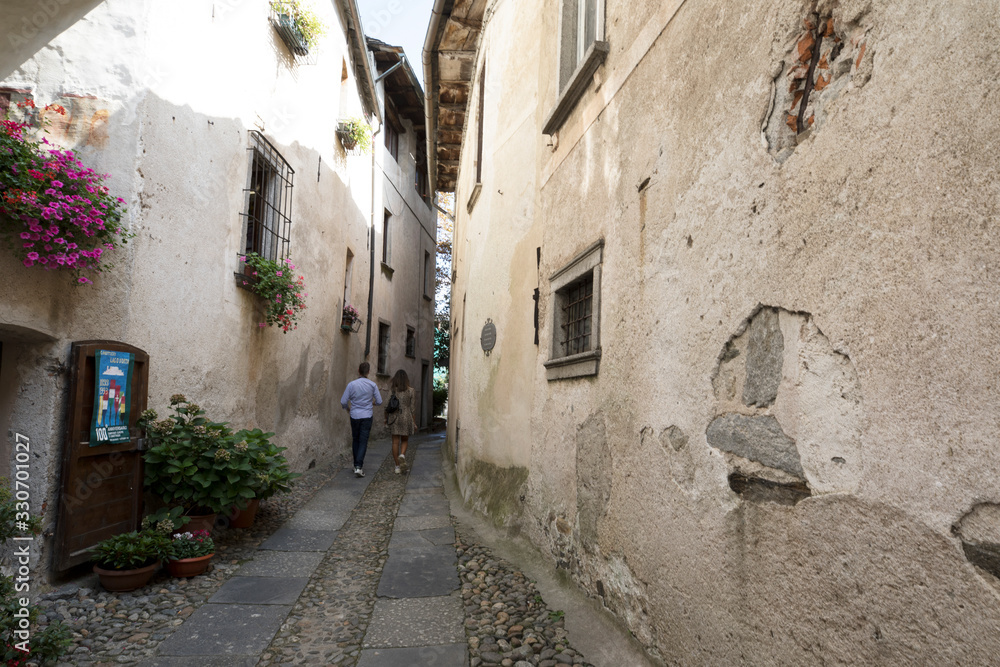 Orta San Giulio (NO), Italy - September 02, 2019: A typical small road in Orta San Giulio island, Orta, Novara, Piedmont, Italy