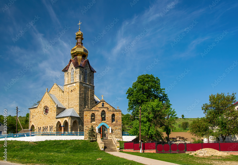 Neo Gothic Church of Erection Lords Honest Cross in Pidhaichyky, Ternopil region, Ukraine Neo Gothic Church of Erection Lords Honest Cross in Pidhaichyky, Ternopil region, Ukraine