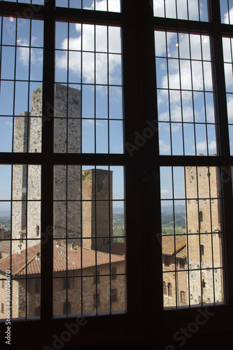 San Gimignano  SI   Italy - April 10  2017  View of San Gimignano towers from a window  Siena  Tuscany  Italy