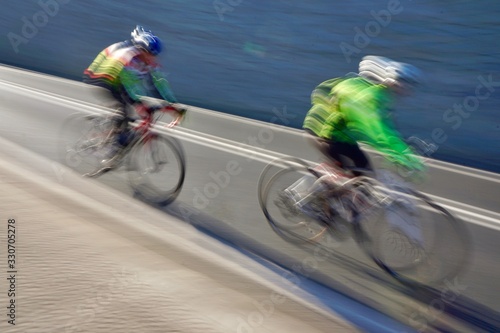 people ciclyng on the street in Bilbao city Spain, mode of transport photo