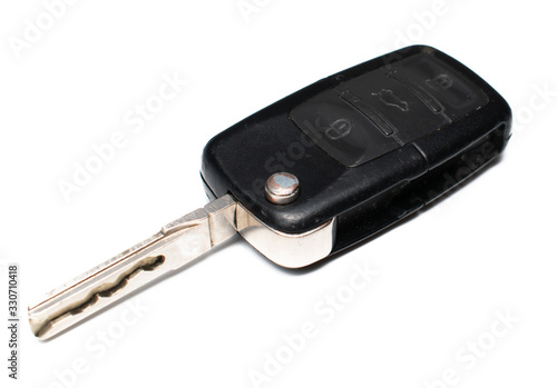 Black car key on a white background. Key with remote, for opening a car from a distance. © Paraschiv