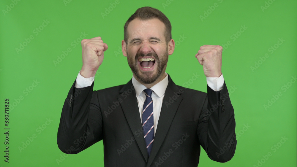 The Happy Businessman getting Surprise and showing Fists against Chroma Key The Happy Businessman getting Surprise and showing Fists against Chroma Key