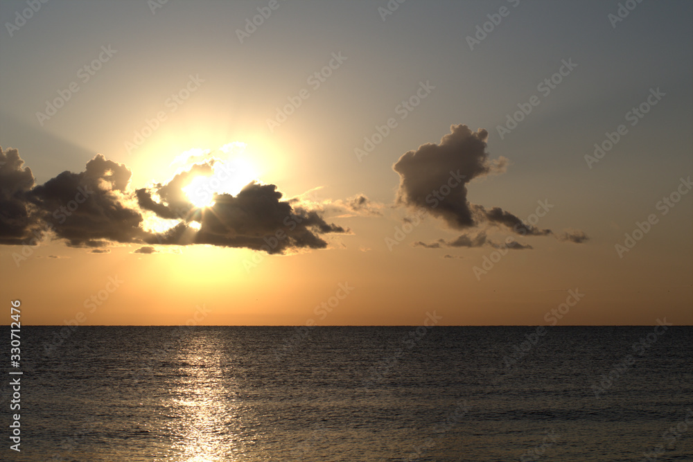 sunset over the sea,sunrise,seascape,horizon,calm,nature,cloudscape,view,sunlight, light,sun,cloud,