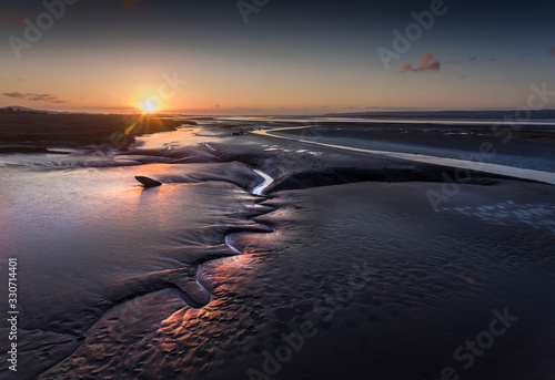 Sunset at low tide on the Loughor Estuary, Penclawdd, North Gower, Swansea, UK