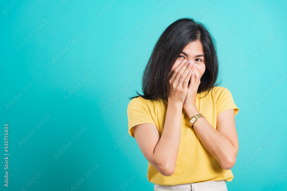 woman wear t-shirt happy excited laughs covering mouth woman wear t-shirt happy excited laughs covering mouth
