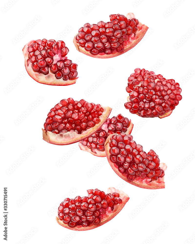 Falling pomegranate isolated on white background, full depth of field, clipping path Falling pomegranate isolated on white background, full depth of field, clipping path