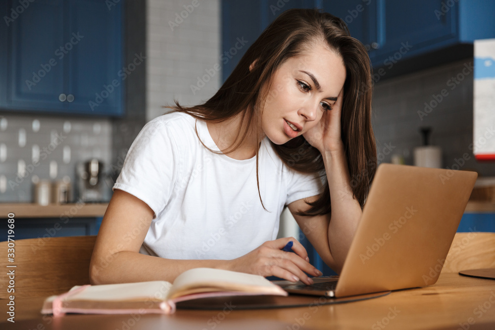 Concentrated woman using laptop Concentrated woman using laptop