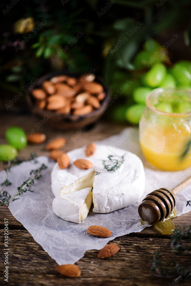 Farmer camembert cheese on the cutting board. selective focus Farmer camembert cheese on the cutting board. selective focus