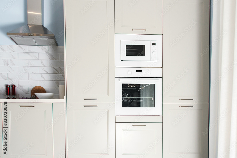 Modern kitchen interior. Built-in kitchen appliances in a modern interior. Contemporary kitchen design. Modern kitchen interior. Built-in kitchen appliances in a modern interior. Contemporary kitchen design.