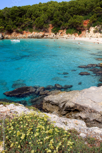 Es Migjorn Gran, Menorca / Spain - June 25, 2016: The Escorxada beach and bay, Es Migjorn Gran, Menorca, Balearic Islands, Spain