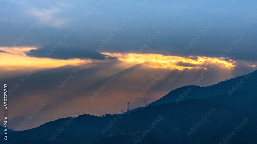 In the dusk of town, clouds cover the mountains In the dusk of town, clouds cover the mountains