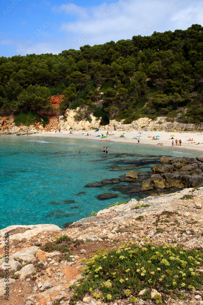 Es Migjorn Gran, Menorca / Spain - June 25, 2016: The Escorxada beach and bay, Es Migjorn Gran, Menorca, Balearic Islands, Spain