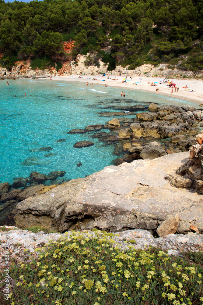 Es Migjorn Gran, Menorca / Spain - June 25, 2016: The Escorxada beach and bay, Es Migjorn Gran, Menorca, Balearic Islands, Spain Es Migjorn Gran, Menorca / Spain - June 25, 2016: The Escorxada beach and bay, Es Migjorn Gran, Menorca, Balearic Islands, Spain