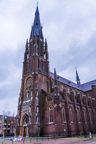 side view of the Saint Lambertus church in Veghel city, the Netherlands, popular medieval architecture by pierre cuypers photo