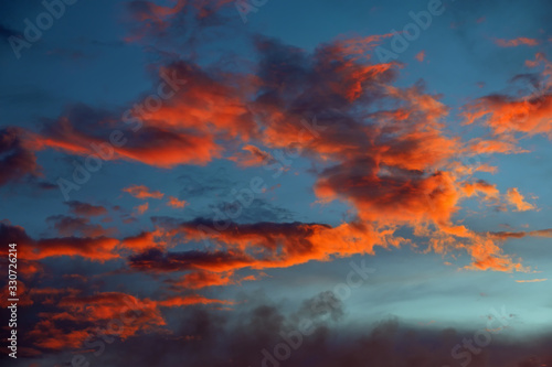 Beautiful Twilight sky background. Colorful Fiery orange and red sunset sky. © es0lex